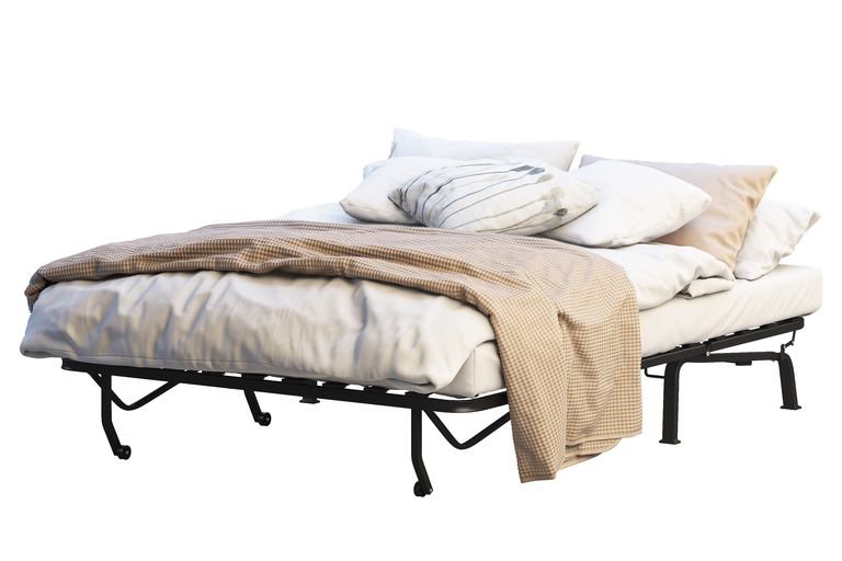 Minimalistic portable bed with linen